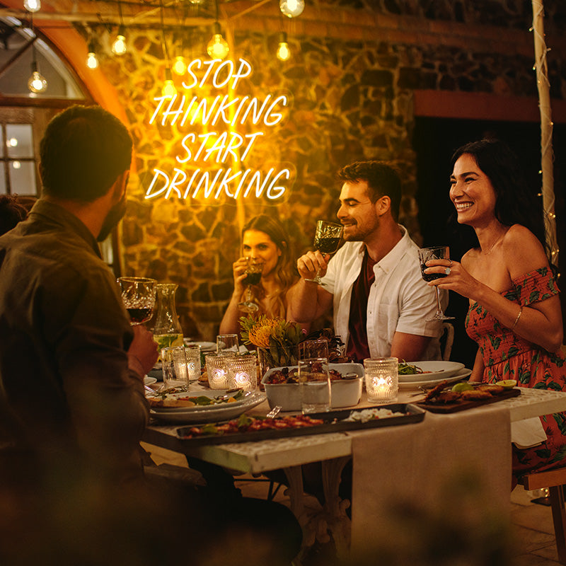 Stop Thinking Start Drinking neon bar sign