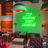 Stop Thinking Start Drinking neon bar sign