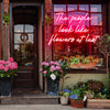 The people look like flowers at last neon sign